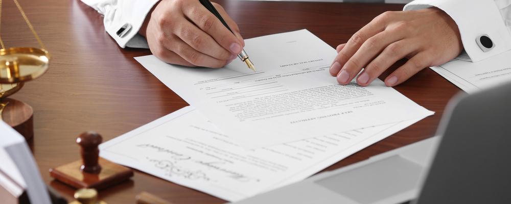 Will contest and inheritance disputes attorney signing last will papers
